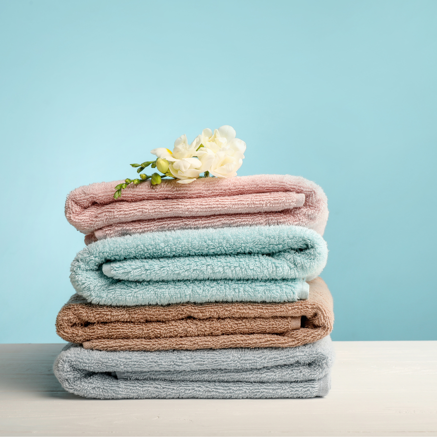 Wash & Fold 2 Stack of freshly washed and folded towels representing hypoallergenic laundry services